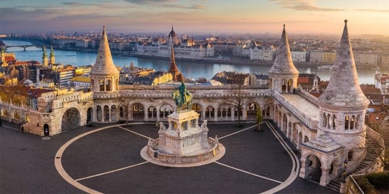 Fisherman's Bastion in the evening with a view of the Hungarian Parliament